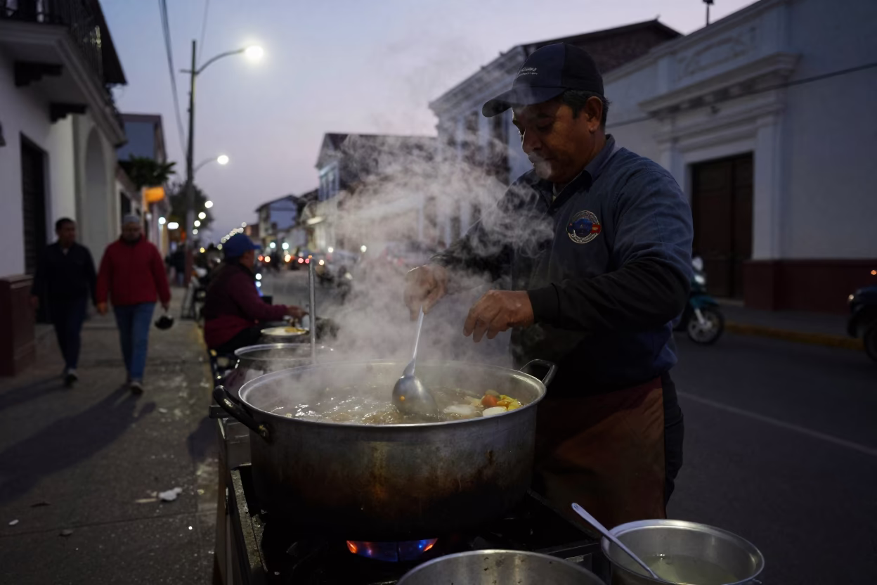 Lima Peru Predawn Street Vendor Cooking Breakfast with Steam and Early Morning Light in in Lima, Peru
