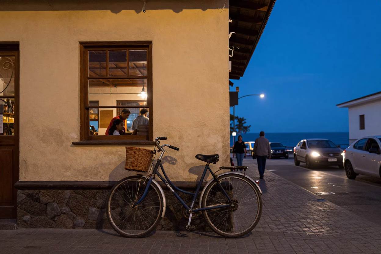 Lima Peru Twilight Street Scene with Bicycle Leaning Against Cafe Wall and Ocean Horizon in in Lima, Peru