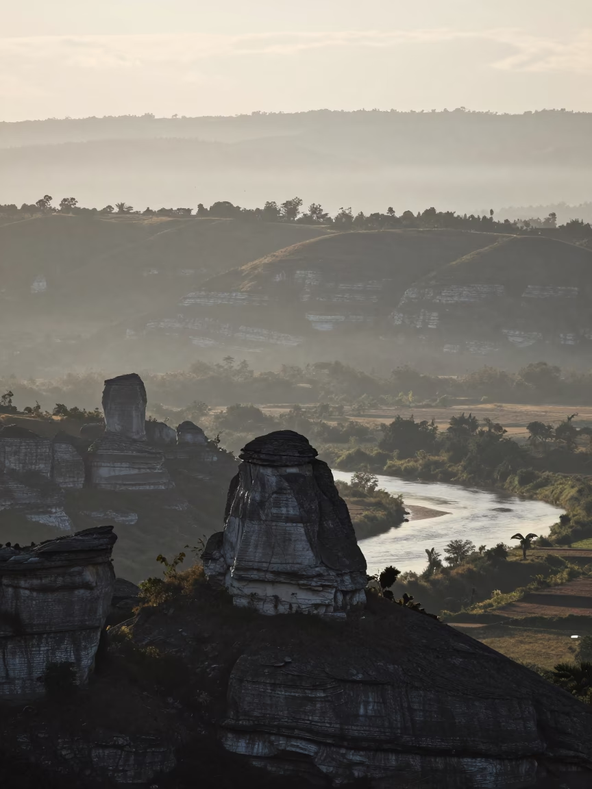 Limestone Karst Tower in Monsoon Dawn Mist in from a ridge above layered foothills near Avellaneda