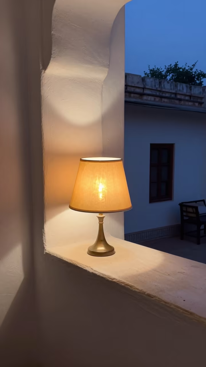 Limewashed Lampshade Twilight Udaipur Interior in on a painted display ledge near Udaipur