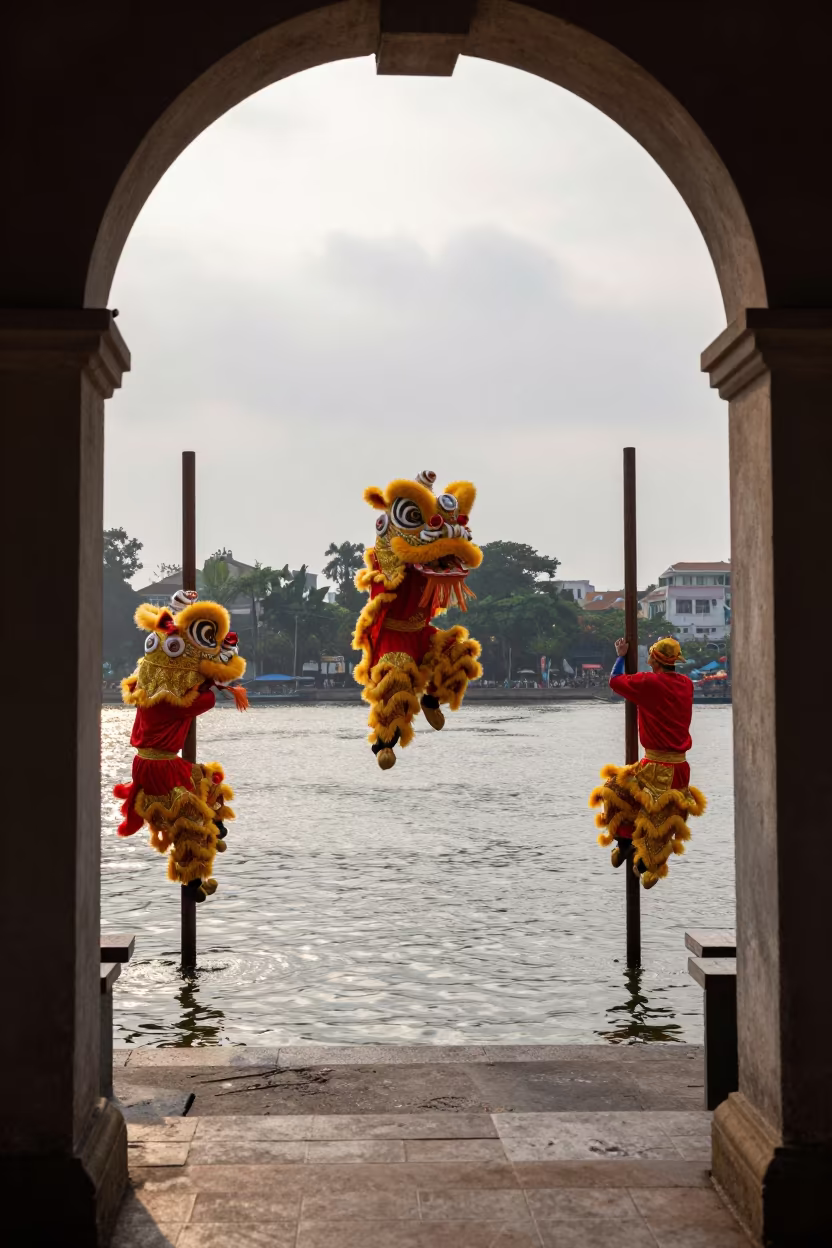 Lion Dance Troupe Poles Hanoi Waterfront in at a waterfront celebration in Long Bien, Hanoi