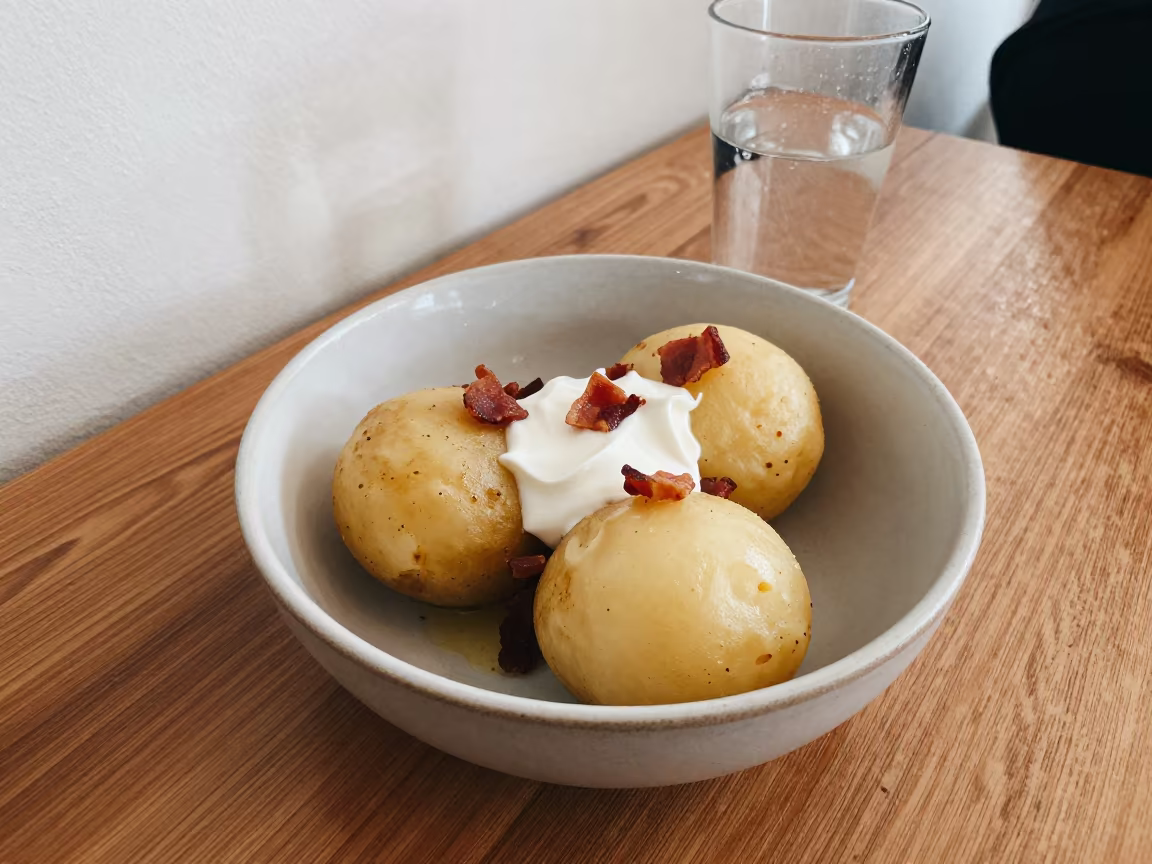 Lithuanian Cepelinai Dumplings Near Window in Guayaquil in on a cafe table by a window near Guayaquil
