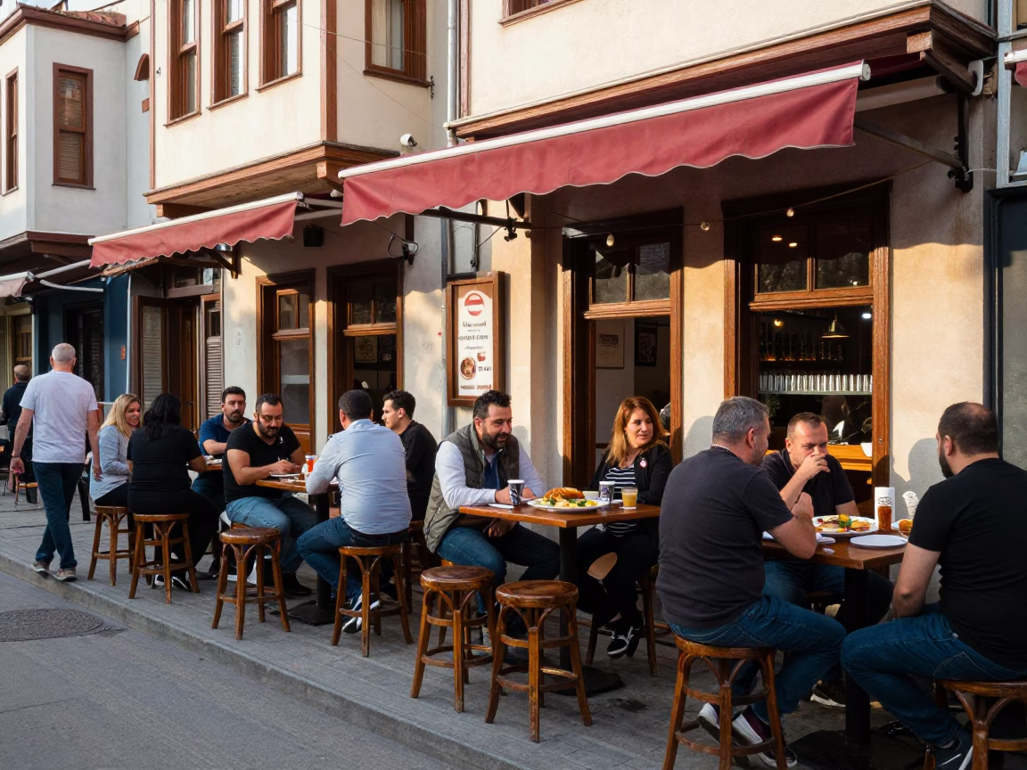 Lively Istanbul Street Cafe Scene with Lahmacun and Bar Stools in Late Afternoon Light in in Istanbul, Turkey