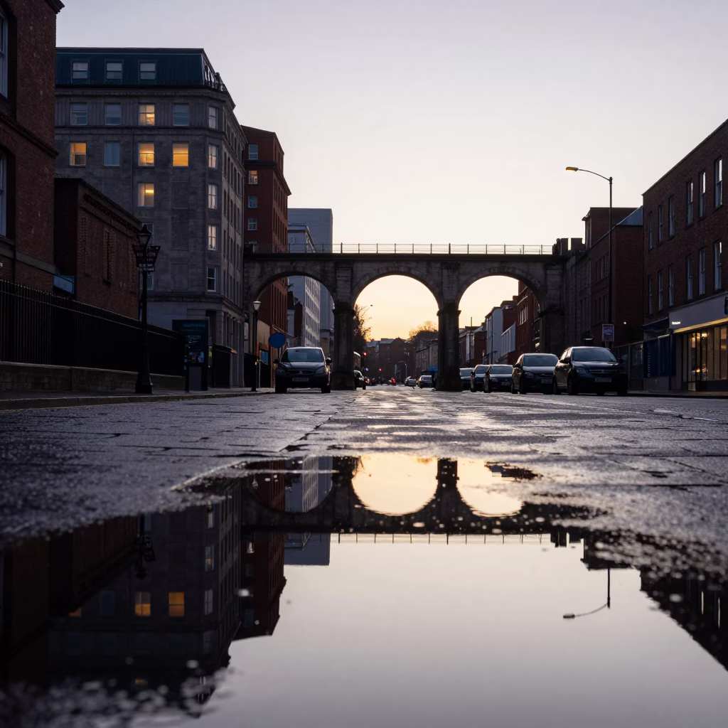 Liverpool Dawn Reflections on Wet Pavement Near Railway Viaduct Arches in in Liverpool, United Kingdom