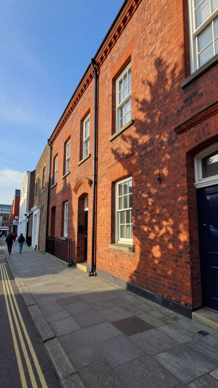 Liverpool England Street Scene Late Afternoon Light Brick Building and Sidewalk in in Liverpool, United Kingdom