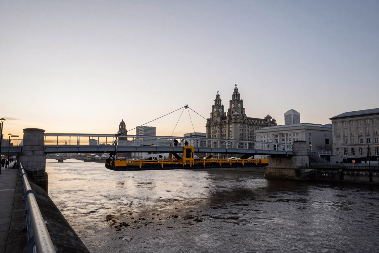 Liverpool Evening Bridge Maintenance Cradle Over River Water with Brick Architecture in in Liverpool, United Kingdom