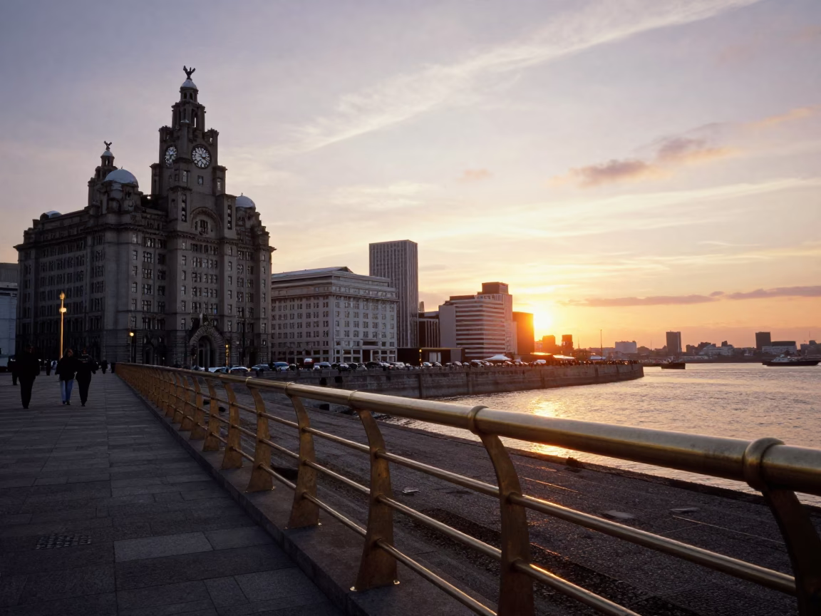 Liverpool Pier Head at Sunset with Polished Brass Rail and Busy Promenade in in Liverpool, United Kingdom