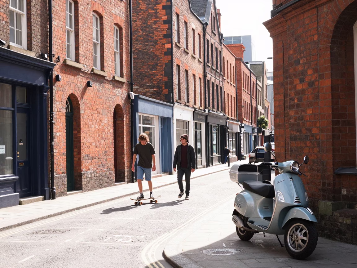 Liverpool Street Scene Midmorning with Skateboarder and Vintage Vespa on Cobblestones in in Liverpool, United Kingdom