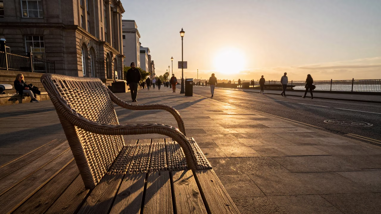 Liverpool Sunset Street Scene with Wicker Shadow on Bench and Urban Life in in Liverpool, United Kingdom