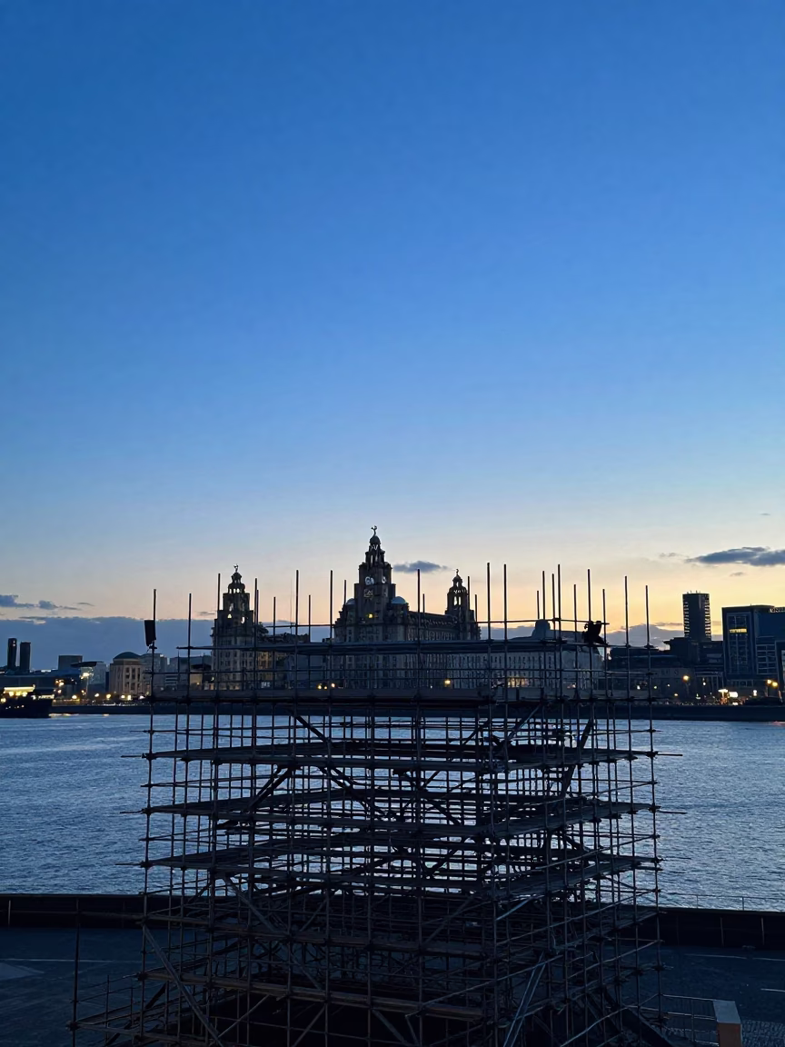 Liverpool Twilight Harbor View with Scaffolding Silhouette and Distant Ship in in Liverpool, United Kingdom