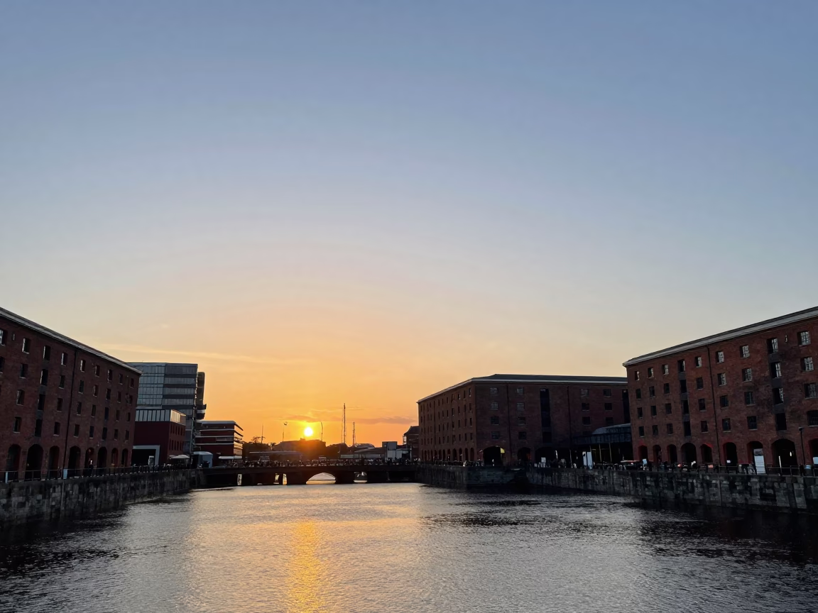 Liverpool Waterfront Sunset View of Albert Dock Brick Warehouses and Moored Boats in in Liverpool, United Kingdom