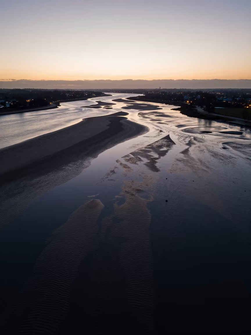 Loire Valley Tidal Flats Ripples at Dusk Silhouette in far above surf-scalloped coastline in the Loire Valley