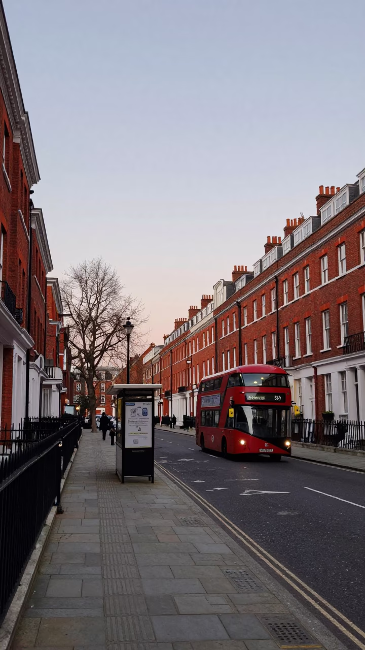 London Dawn Street Scene with Red Bus and Brick Architecture in in London, United Kingdom