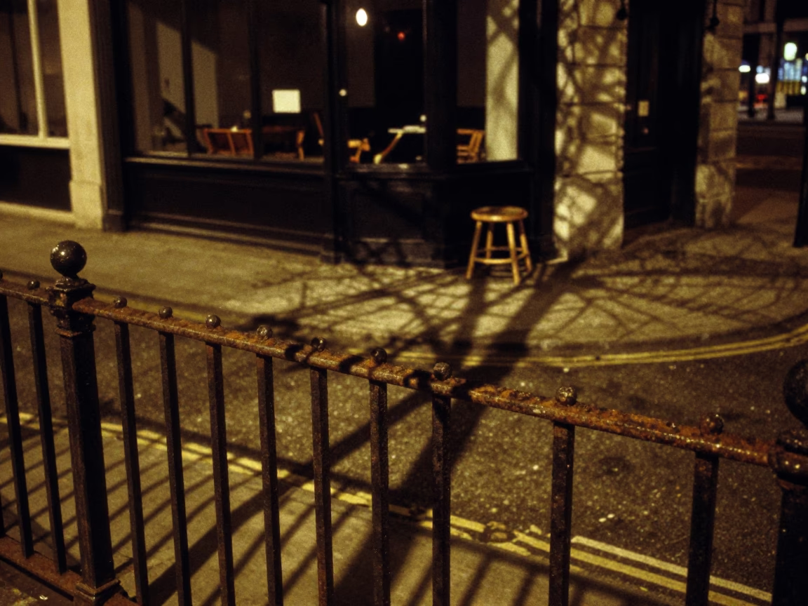 London Midnight Street Scene with Wicker Shadow on Rail and Kitchen Stool in Window in in London, United Kingdom