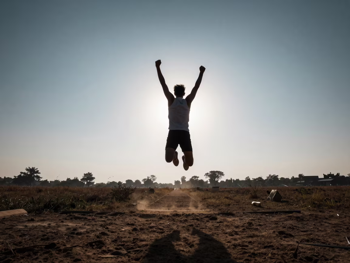Long Jumper Mid Flight at Dawn in Akola Fields in near open fields near Akola