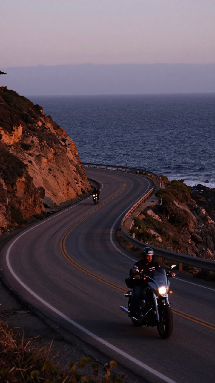 Los Angeles Coastal Highway at Nautical Dawn with Motorcycle Rider and Morning Light in in Los Angeles, California, United States