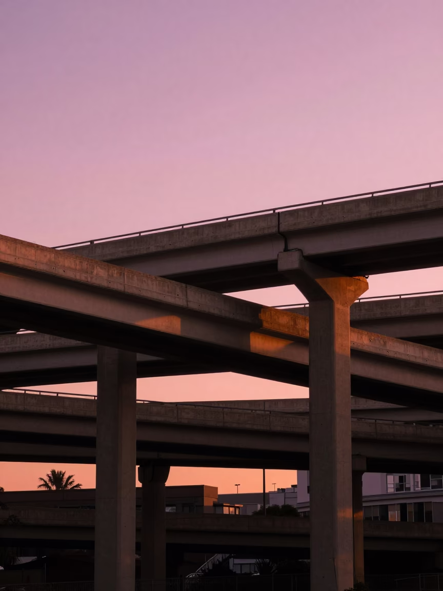 Los Angeles Highway Flyover Stack Against Pink Evening Sky with Cityscape Details in in Los Angeles, California, United States