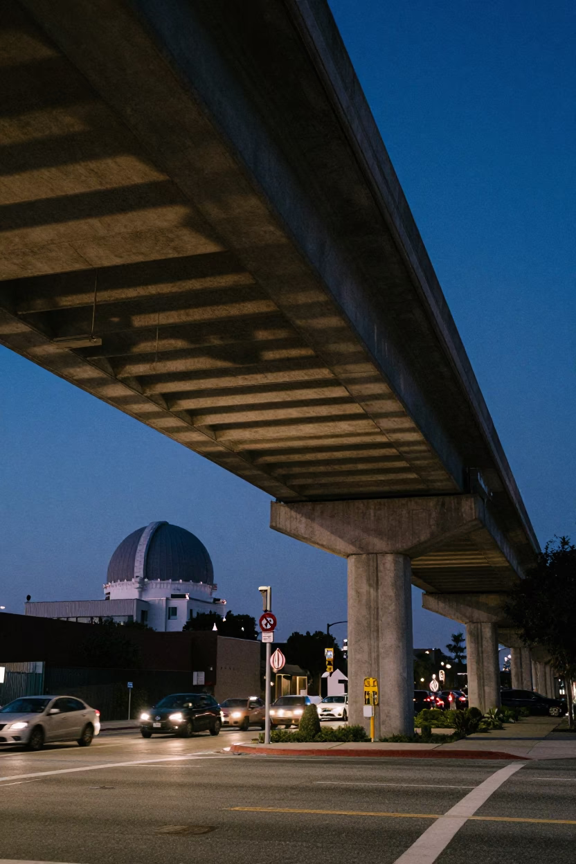 Los Angeles Indigo Twilight Under Concrete Flyover Shadow with Observatory Dome Silhouette in in Los Angeles, California, United States