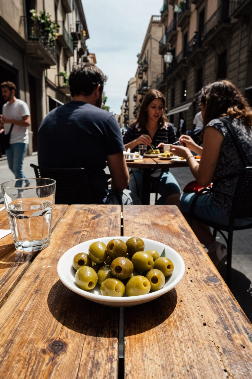 Lunchtime Street Scene in Barcelona Spain with Olive Dish and Glass Carafe in in Barcelona, Spain