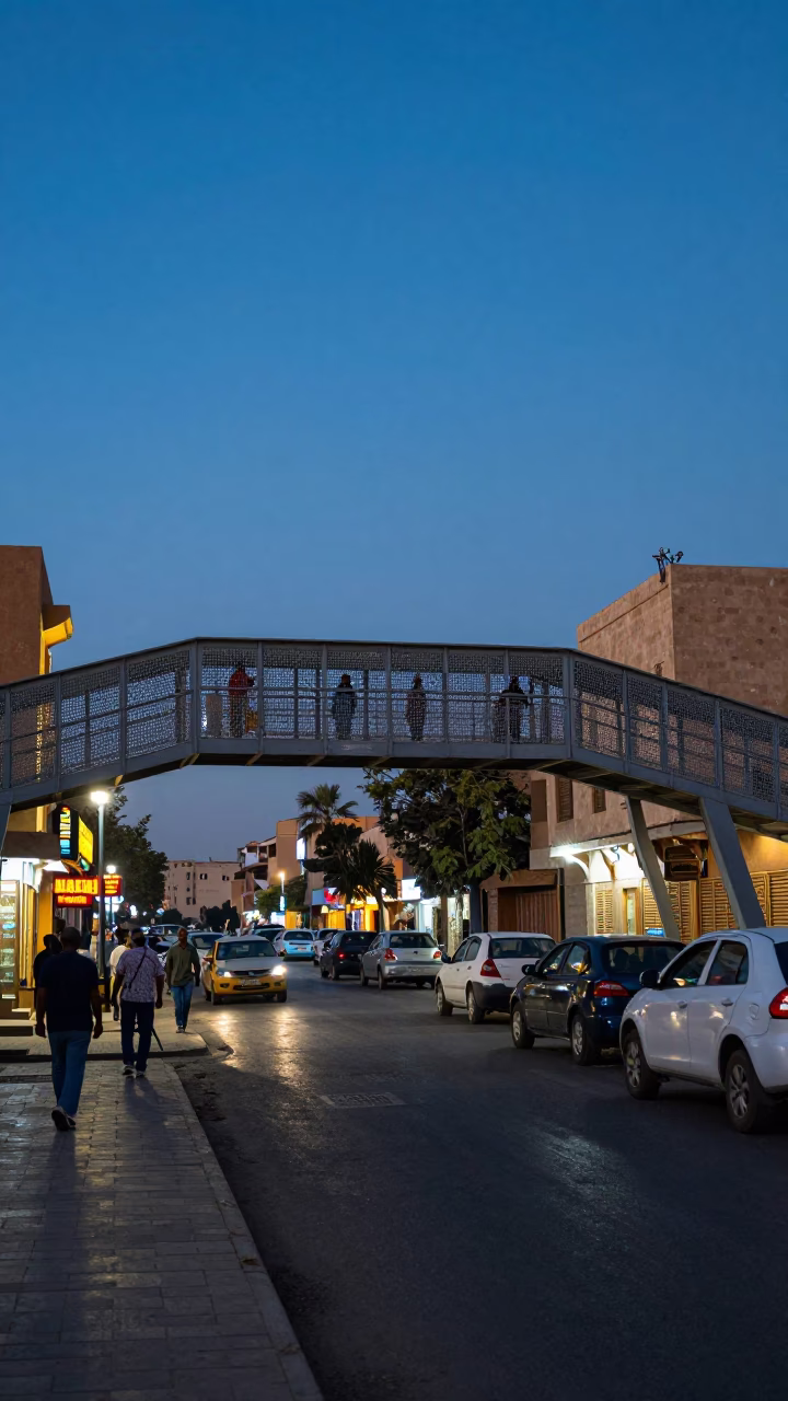 Luxor Egypt Blue Hour Street Scene with Pedestrian Overpass and Local Life in in Luxor, Egypt