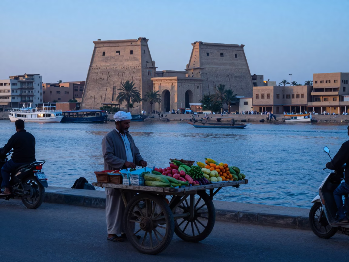 Luxor Egypt street scene before sunrise with vendor and traditional boat in in Luxor, Egypt