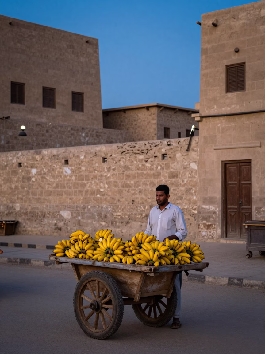 Luxor Egypt Twilight Street Scene with Banana Vendor and Traditional Nubian Architecture in in Luxor, Egypt