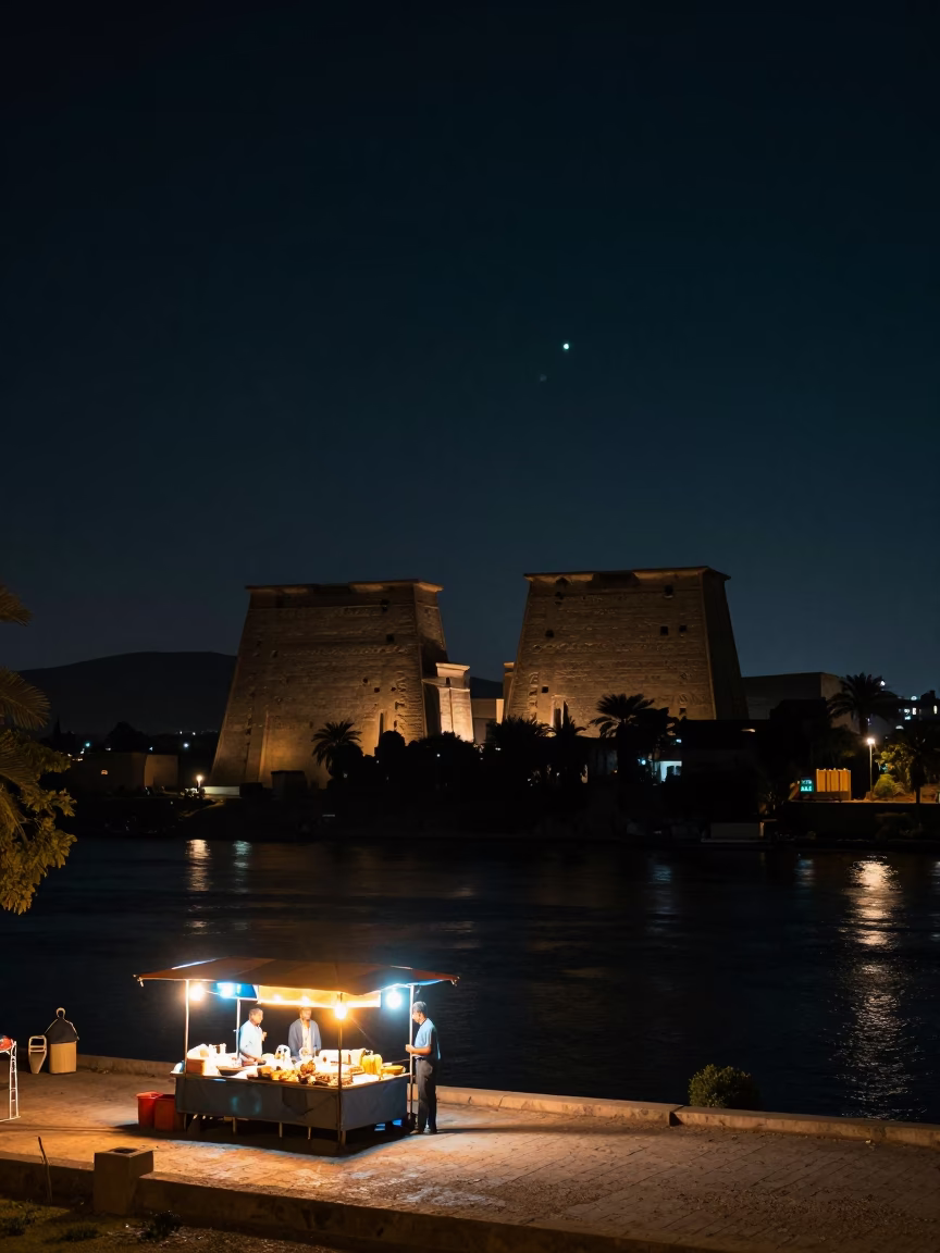 Luxor Nile Riverbank Under Deep Night Sky With Street Vendor And Local Patrons in in Luxor, Egypt