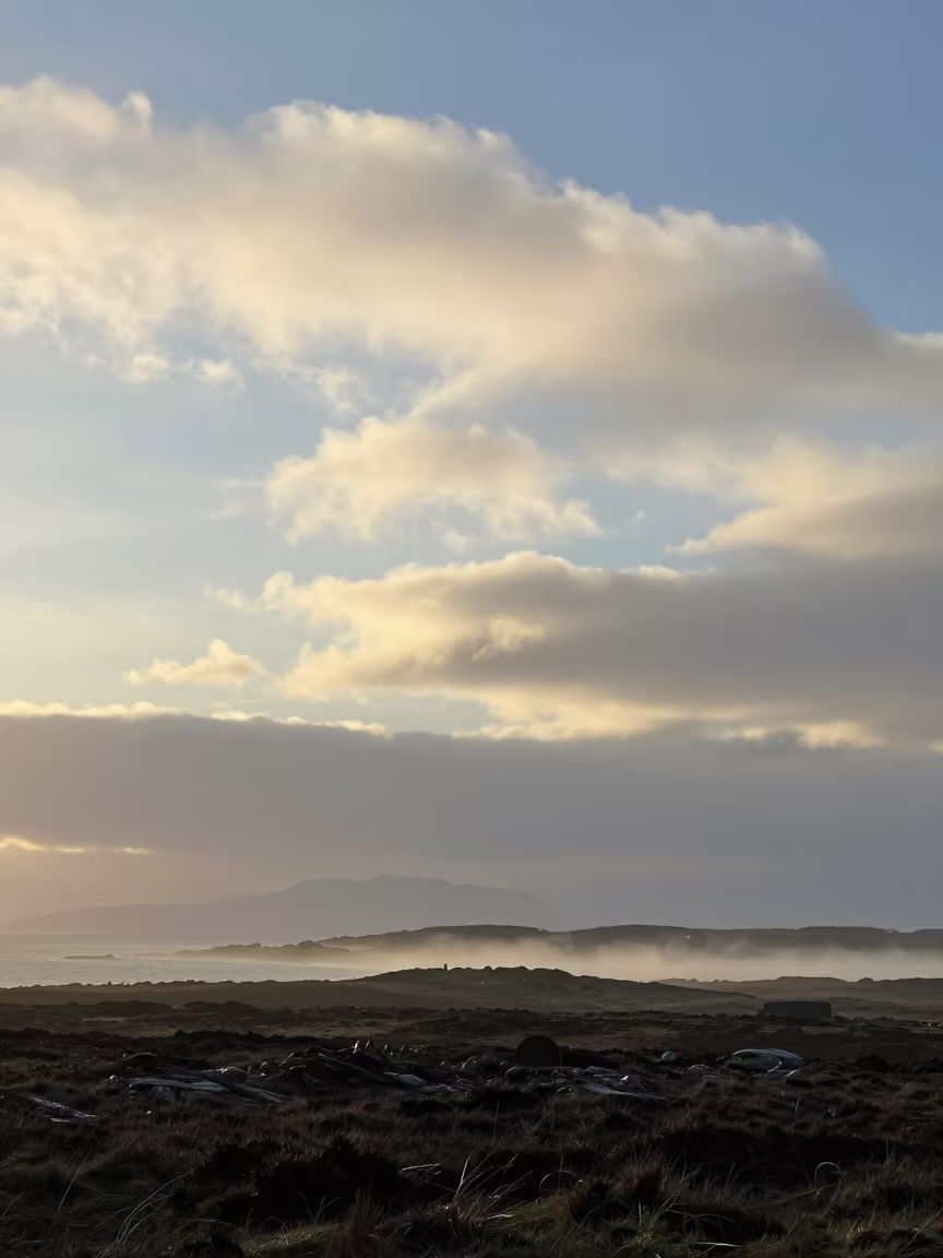 Mackerel Sky Dawn Over Stormy Scottish Isles in across a storm-bright plain in the Scottish Isles