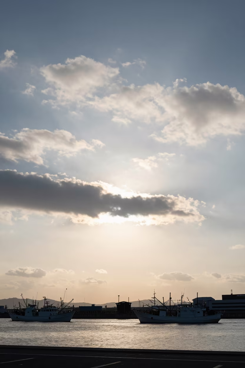 Mackerel Sky Sunset Over Quiet Osaka Harbor in beneath fast-moving cloud bands near Osaka