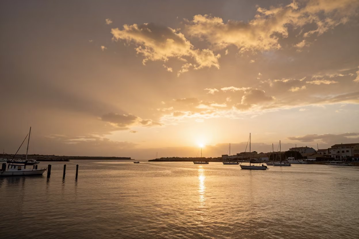 Mackerel Sky Sunset Over Sicilian Harbor in beneath fast-moving cloud bands in Sicily