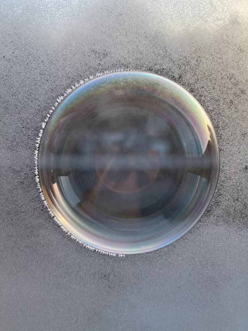 Macro Soap Bubble Colors on Frost Window Kandahar in along a frost-edged windowpane near Kandahar