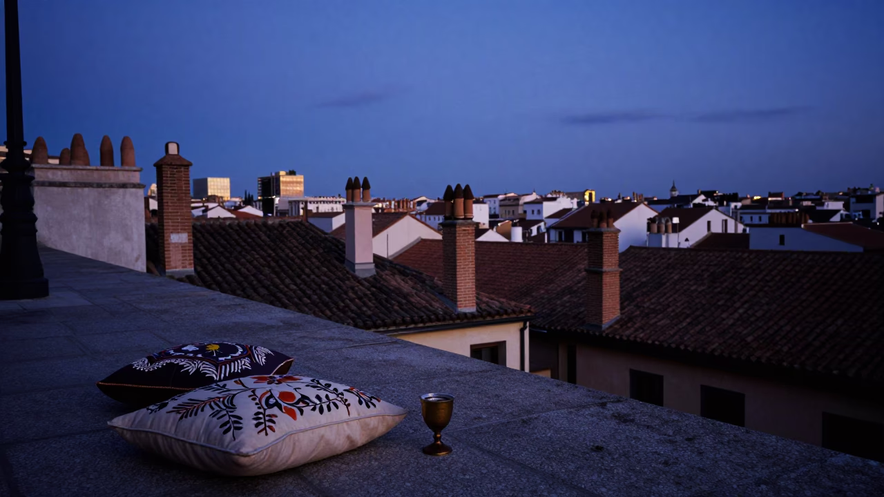 Madrid Spain Blue Hour Street Scene with Embroidered Cushion and Goblet on Balcony in in Madrid, Spain