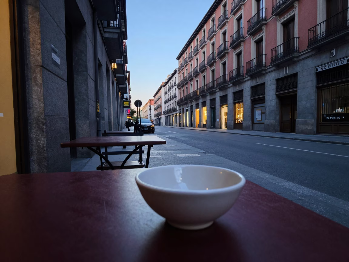 Madrid Spain dawn street scene with traditional ceramic bowl and bread near historic architecture in in Madrid, Spain