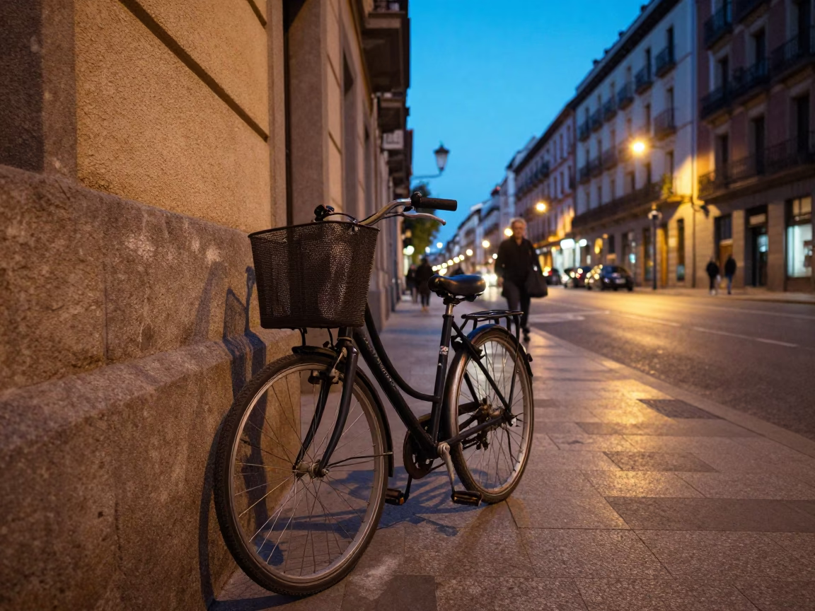 Madrid Spain Evening Street Scene with Bicycle Basket and City Lights in in Madrid, Spain
