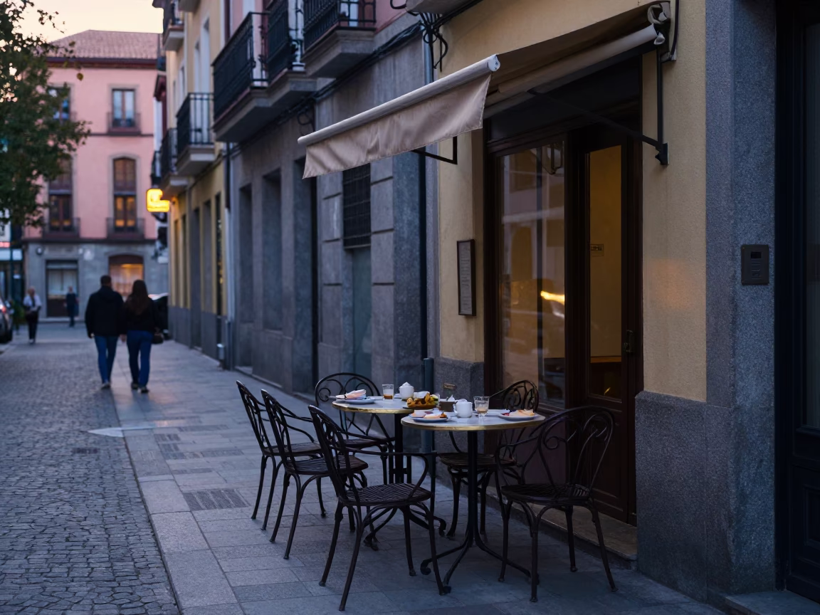 Madrid Spain Pre-Dawn Street Scene With Traditional Breakfast And Early Commuters in in Madrid, Spain