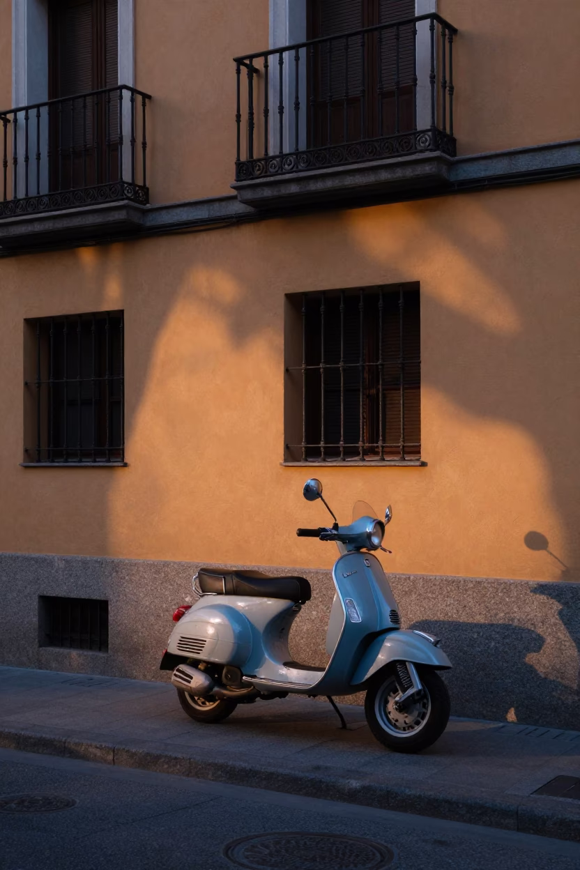 Madrid Spain pre-dawn street scene with vintage scooter and urban architecture in in Madrid, Spain