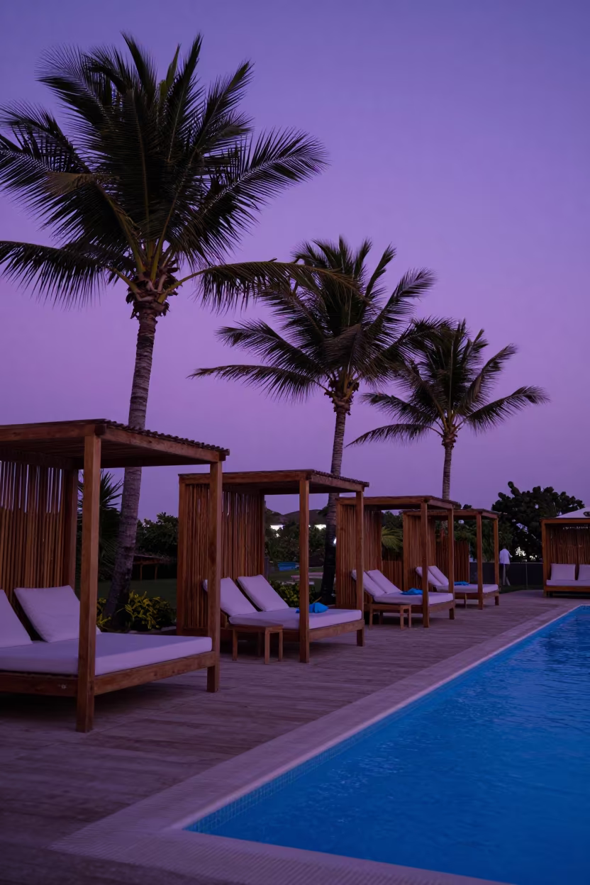 Magenta Sky Over Tanzanian Resort Cabanas in on a resort pool deck in Dar es Salaam