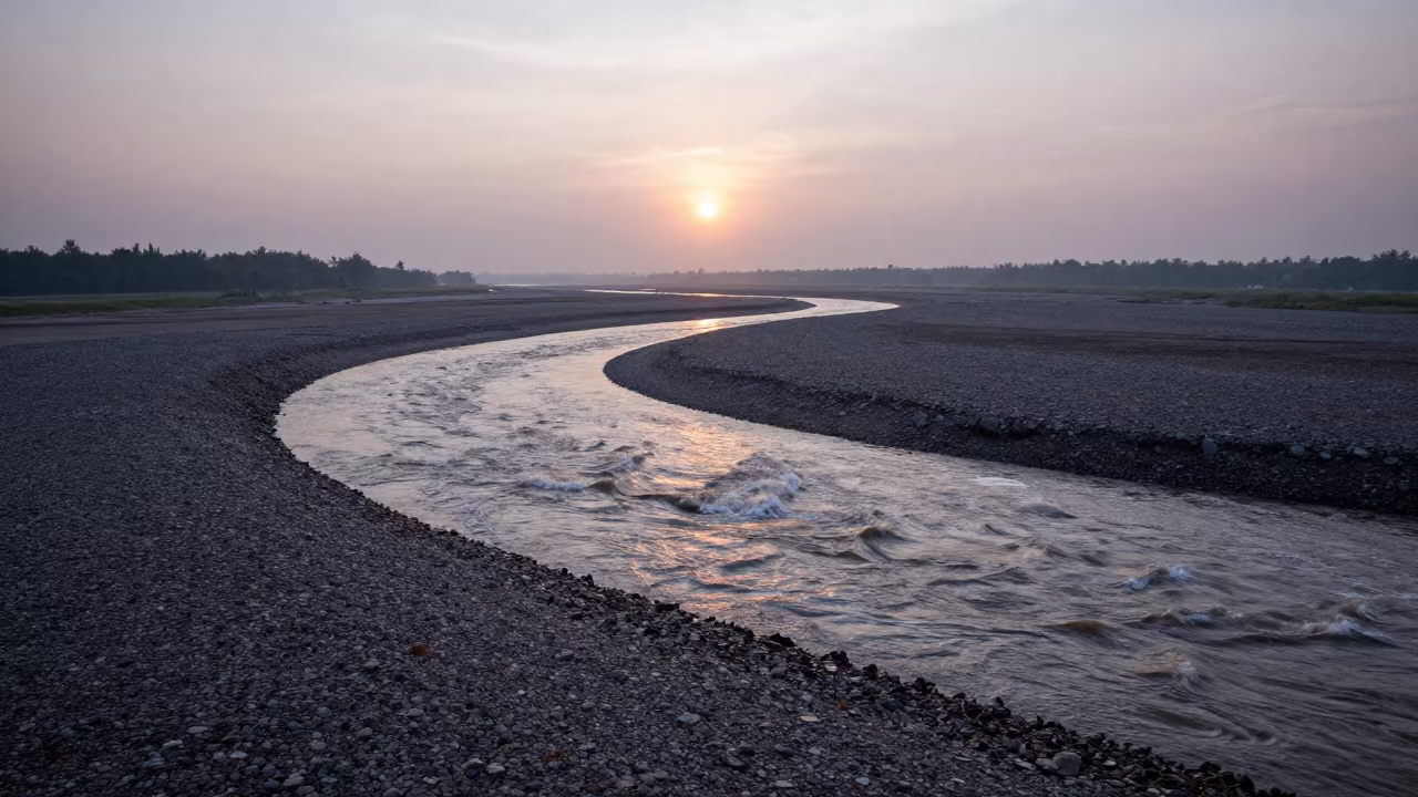 Malaysian River Braiding Through Gravel Before Sunrise in along a wave-cut shoreline in Malaysia