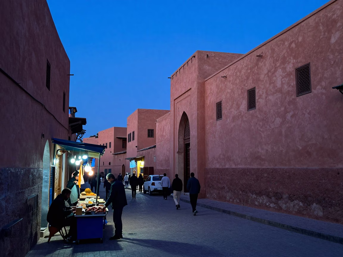Marrakech Morocco indigo twilight street scene with local vendors and traditional architecture in in Marrakech, Morocco