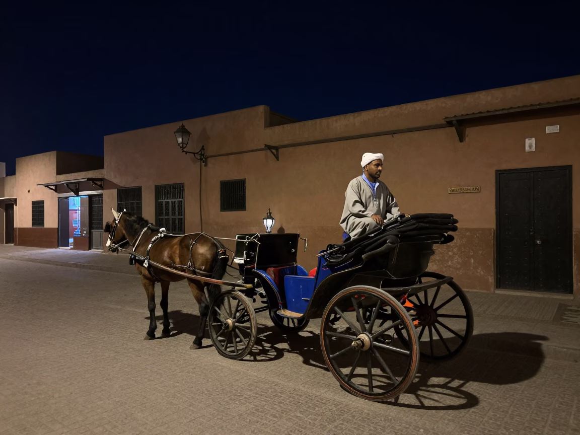 Marrakech Night Street Scene with Horse Carriage and Lantern Light Under Deep Sky in in Marrakech, Morocco