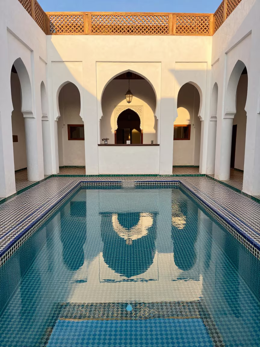Marrakech Riad Pool with Cedar Shadows in at a reception desk under warm light in Marrakech