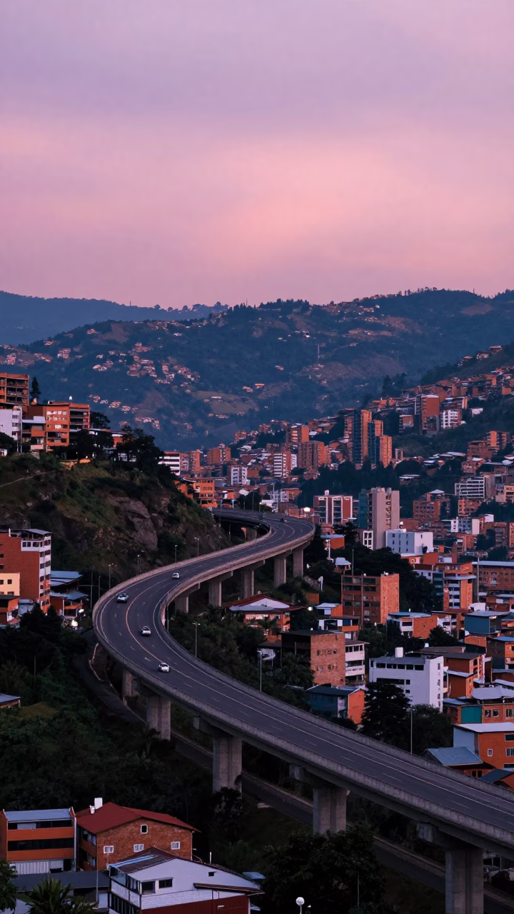 Medellin Colombia indigo twilight highway flyover stack against pink evening sky in in Medellin, Colombia