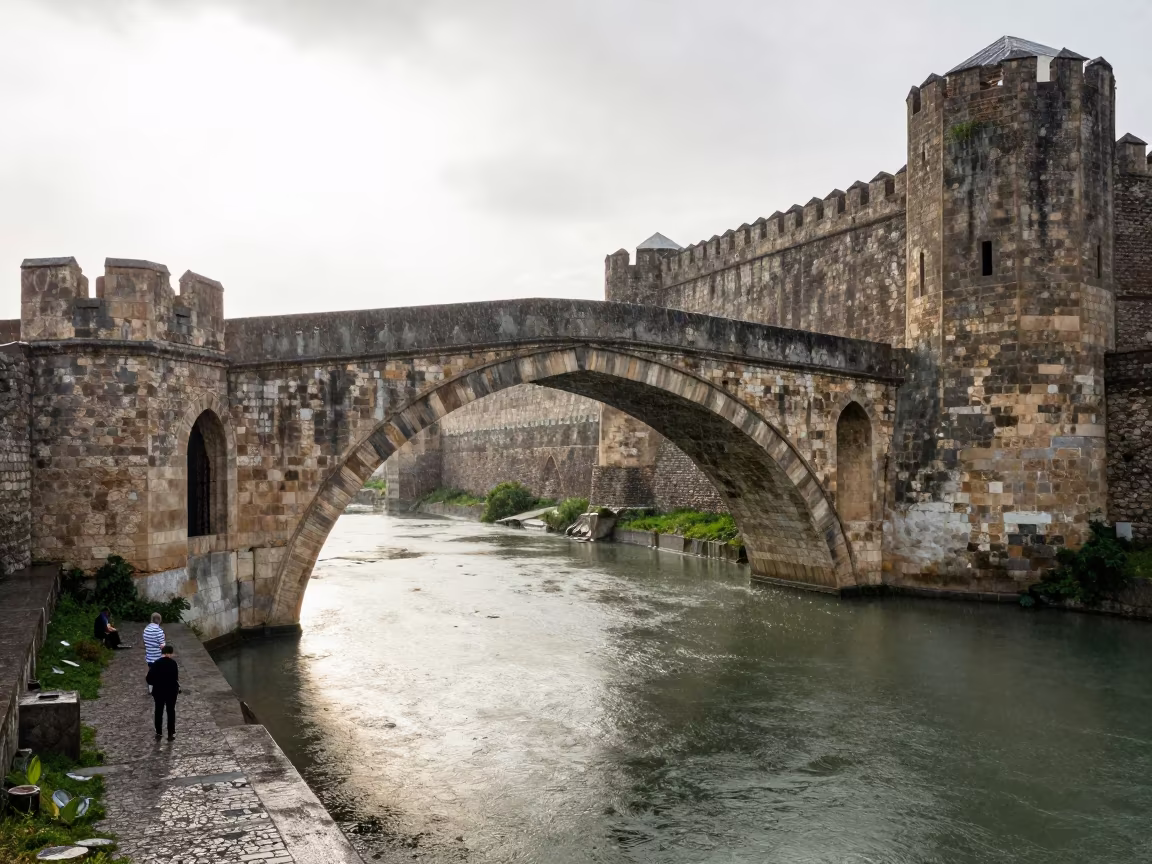 Medieval Stone Bridge Reflected in Azerbaijan in outside a wind-scoured fortress wall in Azerbaijan