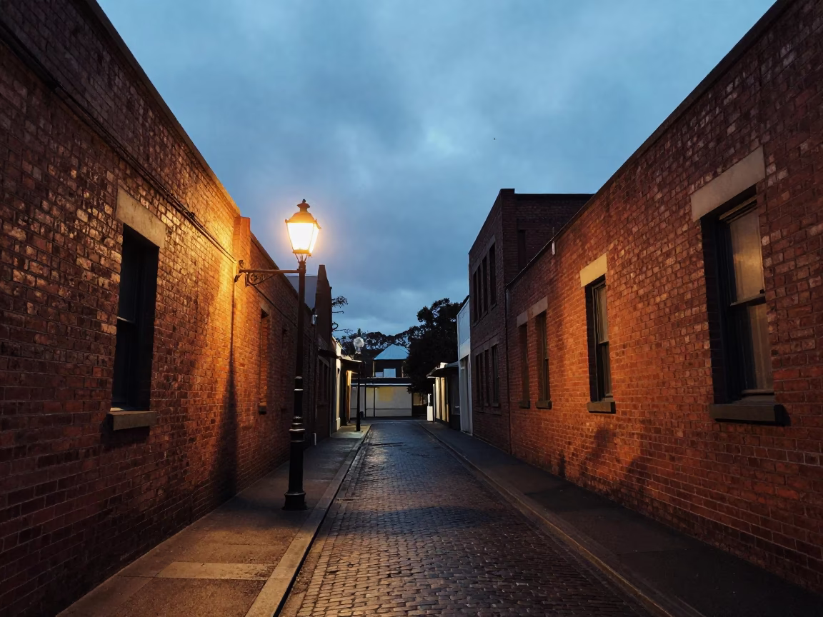 Melbourne laneway at twilight with vintage street lamp and wet cobblestones in in Melbourne, Victoria, Australia