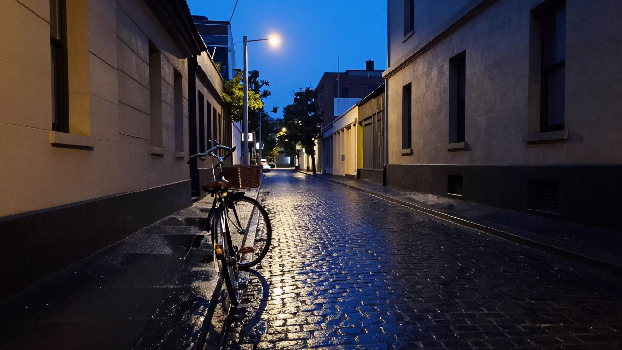 Melbourne laneway dawn with vintage bicycle and wet cobblestones in in Melbourne, Victoria, Australia