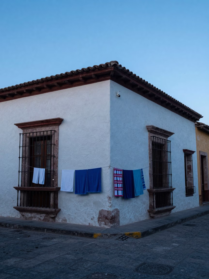Merida Mexico Before Dawn Street Scene with Drying Towels and Quiet Morning Activity in in Merida, Mexico