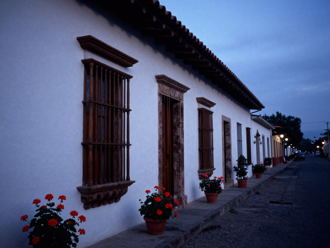 Merida Mexico before dawn street scene with geraniums and colonial architecture in in Merida, Mexico