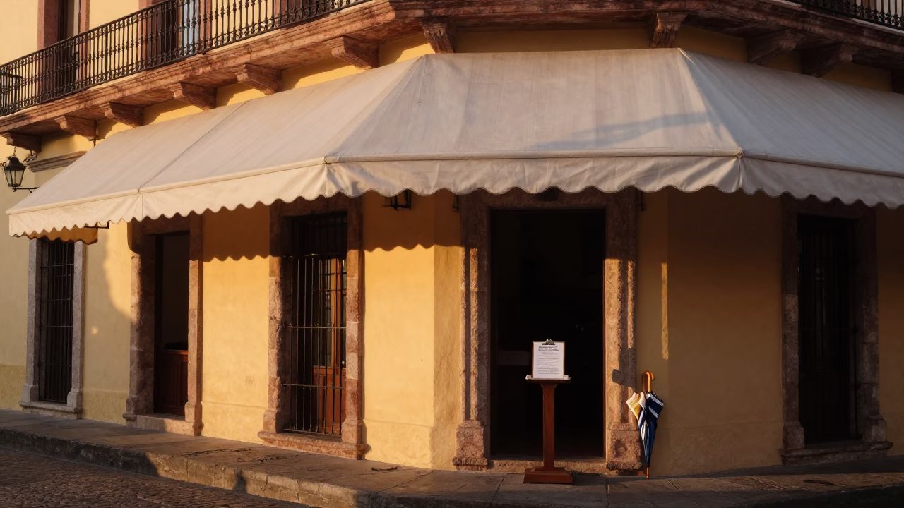 Merida Mexico Evening Street Scene with Hotel Awning and Vintage Car in in Merida, Mexico