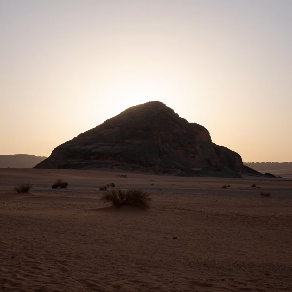 Mesa Silhouette at Dawn in Libyan Desert Valley in across a wide valley floor in Libya