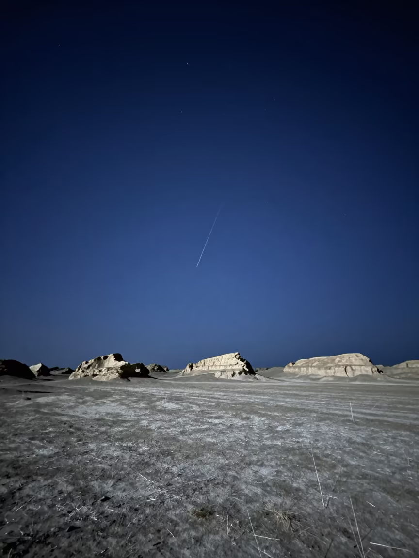 Meteor Fragments Over Yunnan Caldera Moonlit Night in from a moonlit breakwater in Yunnan